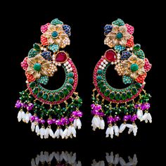 Bejewel an incandescent style and ethereal charm with our Raha Earrings! Unveil the beauty of nauratan stones with pink and emerald colored beads and the sophistication of moti details. Approximate earrings length is. Gold-plated on high-quality brass as base metal. Made by order. Kindly allow 5-7 weeks for the delivery of this item. For custom or urgent requests, please contact support@alacouture.com. *Please Note: We use faux stones and beads in all of our jewelry. Traditional Handmade Multicolor Chandelier Earrings, Elegant Multicolor Jeweled Chandelier Earrings, Multicolor Bohemian Kundan Earrings, Traditional Multicolor Jeweled Chandelier Earrings, Multicolor Meenakari Drop Chandelier Earrings, Gold Ring Designs, Faux Stone, Base Metal, 2 Colours