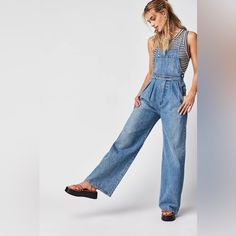 Get Ready To Turn Heads With These Stunning Citizens Of Humanity Mallory Wide Leg Overalls. Made From 100% Organic Cotton Denim, These Overalls Feature A Square Neckline, Button Closure, And Adjustable Straps For A Comfortable Fit. The Wide-Leg Design Is Perfect For Any Occasion, Whether You're Attending A Wedding, A Party, Or Just Running Errands. These Overalls Come In A Beautiful Blue Color And Are Accented With Buttons For A Touch Of Retro Style. They Also Include Pockets For Added Convenien Full-length Denim Jumpsuit For Spring Workwear, High Rise Relaxed Fit Overalls In Medium Wash, High Rise Medium Wash Relaxed Fit Overalls, Relaxed Fit Full-length Denim Jumpsuit, Relaxed Fit Full Length Denim Jumpsuit, Medium Wash High Waist Denim Jumpsuit For Work, Denim Blue Relaxed Fit Overalls, Denim Overalls With Relaxed Fit, High Waist Relaxed Fit Overalls For Workwear