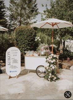 an ice cream cart with flowers on it