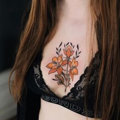 a woman wearing a bra with flowers on her chest and the words bonds written below it