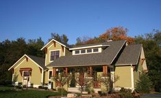 a large yellow house with lots of windows