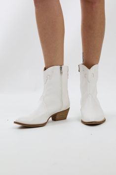 Saddle up in style with our White Pointed Toe Block Heel Western Booties! These boots are a hoedown of fun, boasting a sharp pointed toe and a sturdy block heel that'll have you two-stepping in fashionable comfort. Additional Information Style: Urban Country, Casual Features: Low Heel Pattern: Solid, Stitching Shoe Style: Booties Material & Care Please note that colors may appear differently on screens and may vary slightly from the actual product due to screen settings and lighting conditions. Spring Stacked Heel Snip Toe Heels, Western Booties With Stacked Heel For Spring, Western Style Booties With Stacked Heel For Spring, Spring Mid-calf Boots With Wide Calf And Pointed Toe, Wide Calf Snip Toe Boots For Spring, White Mid-calf Boots With Stacked Heel For Spring, White Snip Toe Boots With Stacked Heel, White Boots With Stacked Heel And Snip Toe, Spring Western Booties With Reinforced Heel