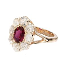 For Sale on 1stDibs - Natural no heat Ruby engagement ring. GIA certified center oval ruby with a halo of 8 old mine cut diamonds in a 18k yellow gold setting. Created in the Luxury Gia Certified Pink Ruby Ring, Oval Ruby Cluster Ring With Rose Cut Diamonds, Red Oval Cluster Ring With Rose Cut Diamonds, Halo Gold Engagement Ring, Ruby Engagement Ring Vintage, Pink Spinel, Ruby Engagement Ring, Yellow Gold Setting, No Heat