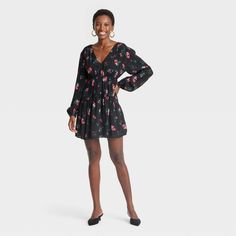 Get ready for casual dates, shopping or any other occasion by dressing in the Balloon Long-Sleeve Dropped Waist Mini A-Line Dress from A New Day™. This mini dress features a V-neckline with long balloon sleeves and pleating along the waist for a flared silhouette. Crafted from 100% rayon fabric, this dropped-waist dress blends chic style with all-day comfort. A New Day™: Style that goes wherever you do. Long Balloons, Casual Date, Dropwaist Dress, Rayon Fabric, Balloon Sleeves, Waist Dress, Drop Waist, A New Day, Black Floral