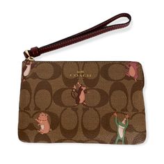 Coach Corner Zip Wristlet In Signature Coated Canvas With Party Animals Print. New With Tag. Signature Coated Canvas And Smooth Leather. Color - Brown, Khaki, Multi. Two Credit Card Slots. Zip Closure. Fabric Lining. Attached Wrist Strap. 6 1/4”L X 4”H X 1/2”D. Ships With Care From A Smoke Free Home. Purple Snake, Animals Print, Leather Clutch Purse, Party Animals, Black Wristlet, Zippered Clutch, Black Leather Wallet, Coach Leather, Pink Beige