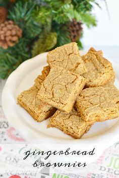 gingerbread brownies on a white plate with pine cones in the background and text overlay