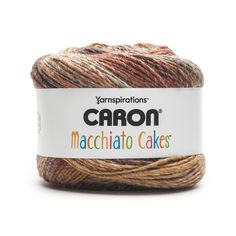 the yarn is brown, orange and green with words on it that say carbon macchiato cakes