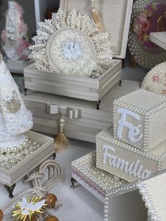 many different types of jewelry are displayed on the table with pearls and other items around them