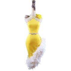 a mannequin dressed in yellow and white feathers