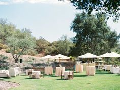 tables and chairs are set up in the grass