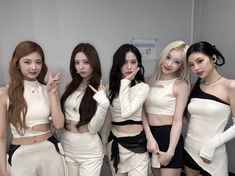 the girls are posing in their white outfits