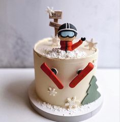 a decorated cake with a skier on top