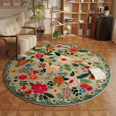 a living room with a chair and rug on the floor in front of a bookshelf