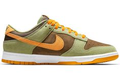 The Nike Dunk Low Dusty Olive is a classic sneaker updated for today. The combination of dusty olive, brown, and pro-gold suede makes this sneaker perfect for any outfit. The brown canvas wraps around the heel leading to a white embroidered “NIKE” logo resting on a Pro Gold suede heel tab. The pro-gold outsole and a white midsole complete the look of this retro Nike Dunk. Dunk Low Dusty Olive, Olive Sneakers, Dunk Lows, Nike Models, Classic Sneakers, Nike Dunk Low, Nike Cortez Sneaker, Dunk Low, Nike Dunk