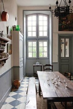 an empty dining room with wooden tables and chairs