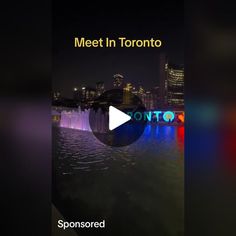 a video screen with the words meet in toronto on it and an image of a city at night