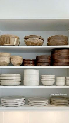 plates and bowls on shelves in a kitchen