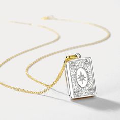 Surprise your loved ones with a treasured keepsake - the Gold and Silver Book Locket Necklace! This exquisite piece features a two-toned gold and silver locket adorned with intricate floral engravings, allowing you to keep cherished memories close. Nestled on radiant 10k gold on brass and accented with shimmering cubic zirconia, it offers a signature finish perfect for best friends, mothers, or partners. A sentimental gift celebrating the bonds you hold dear. 🎁 DETAILS Plating: 10K Gold  Materials: 10K Gold on Silver, Cubic Zirconia Measurements: Length: 15.75 "(40cm)   + Extender: 1.97"(5cm) Pendant Size: 0.47"*0.67"(1.2cm*1.7cm) Weight: 3.8 g Gold Etched Locket Necklace, Gold Etched Locket Necklace For Keepsake, Rectangular Pendant Locket Jewelry For Keepsake, Gold Locket Necklace With Vintage Charm In Spiritual Style, Gold Spiritual Locket Necklace With Vintage Charm, Vintage White Gold Locket Necklace For Gift, Vintage White Gold Locket Necklace Gift, Vintage White Gold Locket Necklace As A Gift, Gold Locket Necklace With Charms For Memorial