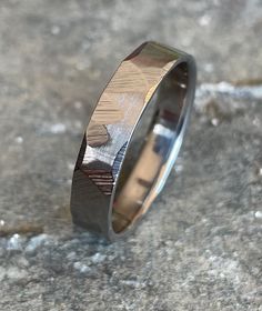 a wedding band that has been made to look like it is inlayed with wood