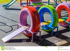 colorful children's play equipment in an amusement park stock photo - image 399782