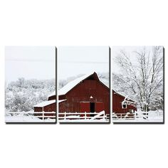 three red barns covered in snow on a snowy day