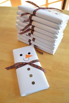 a stack of white paper with a snowman on it