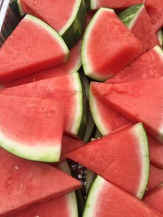 sliced watermelon and cucumber pieces are shown in this close up photo