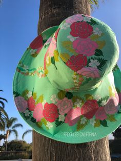 "Super Pretty! Just love the mint green on this tropical print sunhat and the pink flowers look gorgeous against the green. This stunning wide brim sunhat has a large, foldable brim that not only frames your face beautifully when folded up, but protects your face from the sun when the brim is down. I fell in love with this gorgeous fabric while on a weekends getaway, so you will be wearing a very unique and stylish wide brim hat. This sunhat is not only perfect for those sunny days, but absolute Pink Summer Sun Hat For Garden Party, Pink Summer Hat For Poolside, Green Flat Brim Hat For Vacation, Summer Green Sun Hat For Vacation, Green Cotton Sun Hat For The Beach, Pink Summer Hat For Garden Party, Pink Poolside Sun Hat For Spring, Green Flat Brim Bucket Hat For Vacation, Green Flat Brim Bucket Hat For Spring