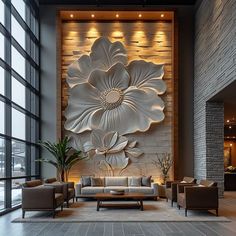 a living room filled with lots of furniture next to a large flower painting on the wall