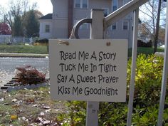 a sign that reads read me a story tuck me in tight say a sweet prayer kiss me goodnight