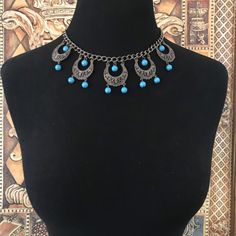 ON SALE Huge Sale Going On Now.... Ends Soon!! Pretty blue beaded vintage 1960s necklace in good vintage condition. Measures 16 and three-quarter inches long by almost 2 inches dangling down. Would dress up any outfit and is a nice addition to any collection. Blue Dangle Beaded Costume Jewelry Necklace, Vintage Blue Choker Necklace, Vintage Blue Choker Jewelry, Vintage Blue Beaded Turquoise Necklace, Vintage Blue Handmade Choker, Blue Handmade Vintage Choker, Vintage Blue Beaded Chain Necklace, Vintage Blue Necklace With Beaded Chain, Blue Beaded Necklace With Dangling Beads For Costume Jewelry