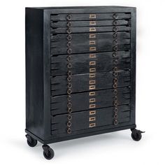 a black cabinet with lots of drawers on it's sides and wheels in front of a white background