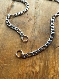 "This open ended chain will hold shackle and carabiner locks. This is 5 mm wide and 16\" in length before the solid bronze jump rings. These jumps rings are closed and 14 gauge thick. The internal diameter is 6.8mm. The brass lock in the photo is in my shop here: https://www.etsy.com/listing/714299876/solid-brass-lock-u-lock-screw-lock-charm" Sterling Silver Link Chain Ring, Sterling Silver Chain Link Ring, Silver Chain Link Ring For Everyday, Everyday Silver Chain Link Ring, Silver Metal Jewelry With Figaro Chain, Stainless Steel Chain Link Jewelry With Hooks, Silver Figaro Chain Link Bracelet, Silver Link Jewelry With Hook And Links, Silver Jewelry With Figaro Chain And Rectangular Links