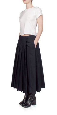 Discover the effortless elegance of the 6397 Pleated Wrap Skirt. Made with a Japanese Typewriter cotton poly blend, this midi length skirt features a pleated design and a relaxed a-line silhouette. With a side zipper closure and front pockets, it's the perfect combination of practicality and style. Details: Color: Black 70% Cotton, 30% Polyester Side zip closure Front pockets Relaxed, A-Line silhouette Vendor Code: NS099 Fits true to size Model is 5ft 5in and is wearing a size S Japanese Skirt, Black Midi Wrap Skirt, Flowy Midi-length Pleated Skirt With Lining, Relaxed Midi-length Lined Pleated Skirt, Relaxed Midi-length Pleated Skirt With Lining, Relaxed Midi-length Pleated Skirt With Elastic Waistband, Black A-line Voluminous Pleated Skirt, Cute Jeans, Midi Length Skirts