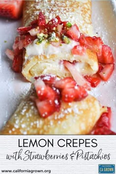 lemon crepes with strawberries and pistachios on a white plate