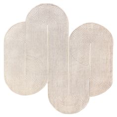 three oval rugs in white on a white background, each with an interlocked design