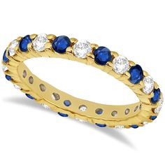 a yellow gold ring with blue and white stones