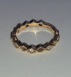 Beautifully vintage. Solid 14K Yellow Gold Diamond Ring. Eternity Band. Beaded detail Marquise design with natural, round cut Diamonds. Sizing bar in back. Stamped 14K and designer's hallmark. Great alone or stacked. Ring size approximately 5.25 - 5.5. Diamond Jewelry With Decorative Round Band, Round Diamond Jewelry With Decorative Band, Heirloom Stackable Diamond Ring For Anniversary, Gold Marquise Stackable Rings Fine Jewelry, Gold Marquise Diamond Ring Stackable, Fine Jewelry Gold Marquise Stackable Rings, Stackable Marquise Yellow Gold Jewelry, Diamond Jewelry With Decorative Band For Anniversary, 14k Gold Marquise Cut Stackable Diamond Ring