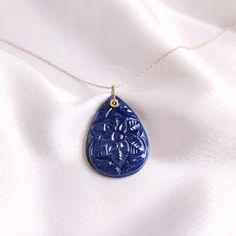 This stunning Drill pendant is set in 14K Solid Yellow Gold with Natural Carved Blue Sapphire with utmost precision. It is an unique gemstone pendant for nearly every occasion and is completely hassle-free jewelry. ITEM DETAILS * Gem: Blue Sapphire * Gem Size: 24x32mm * Gem Shape: Pear carve * Gem Weight: 42.04 carats * Gold Purity: 14KT  * Gold Weight: 0.28 gram * Total Weight of the Pendant: 8.66 gram ✔️The Gold purity is guaranteed and it comes with authentic 14KT gold hallmark. Since my item Exquisite Blue Teardrop Jewelry, Carved Yellow Gold Necklace Perfect For Gift, Carved Yellow Gold Necklace, Carved Yellow Gold Necklace For Gift, Luxury Blue Teardrop Pendant Jewelry, Luxury Carved Blue Jewelry, Luxury Blue Carved Jewelry, Blue Jewelry With Large Pendant For Anniversary, Blue Large Pendant Jewelry For Anniversary