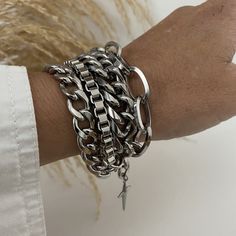 Super chunky 4 strands mixed styles and sizes steel chain bracelet that looks amazing as well with chic or casual outfits.  ADD approximately 1 - 1.25 inch to your wrist size to SELECT A SIZE  MATERIAL * Stainless steel (hypoallergenic, waterproof and won't change color). On pictures, 6.5 inches wrist showing 8 to 8.5 bracelet attached at 8 inches (it is a little too loose). You will receive this beautiful bracelet in a box decorated with bow. Similar bracelet; https://www.etsy.com/ca-fr/listing Trendy Stainless Steel Chunky Chain Bracelet, Trendy Metal Cuban Link Bracelet With Chunky Chain, Trendy Cuban Link Bracelet With Chunky Chain, Trendy Chunky Stainless Steel Jewelry, Chunky Silver Bracelet, Silver Bracelet Stack, Silver Bracelet For Women, Gothic Bracelet, Layered Choker Necklace