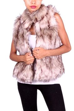 A stunning faux fur vest that could be easily dressed up or kept casual. The 2 slit pockets and clip buttons complete the look of this fully lined vest. This is a high quality vest that does not shed! SMALL MEDIUM LARGE X-LARGE BUST 30” 31” 32” 33” WAIST 36” 37” 38” 39” LENGTH 23” 23” 23” 23” Studded Shoes, Los Angeles Fashion, Brown Shades, Faux Fur Vest, Faux Fur Vests, Fur Vest, Paisley Pattern, Wholesale Fashion, Cute Fashion