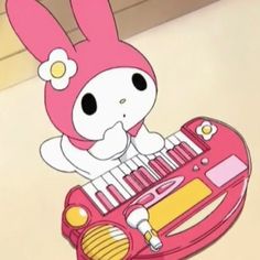 a cartoon rabbit playing an electronic keyboard