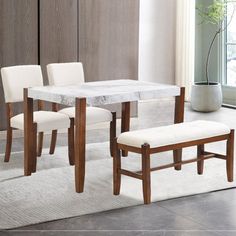 a dining table with four chairs and a bench