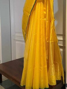 Radiate with resplendent charm in our Bright Golden Yellow Saree, crafted in pure Chanderi silk adorned with small, delicate flower motifs in shimmering gold zari. Each intricate detail captures the essence of elegance, making this saree a true work of art. Paired with a plain unstitched raw silk blouse, available in a variety of colors to suit your preference. Customize your ensemble with the option of tailored blouse stitching, ensuring a flawless fit that accentuates your unique style with an additional cost.🌟 Don't just wear a saree; own the spotlight with Poonam Sarees! 💫🛍️ Fabric: Pure Silk Colour: Same as picture Work: Handwoven Chanderi Wash Care: Dry Clean NOTE: Expect minor variations due to lighting or monitor settings. Our products are handmade, and we do not offer return, r Yellow Handloom Pre-draped Saree For Wedding, Elegant Yellow Pre-draped Saree For Puja, Celebration Slub Silk Saree With Cutdana, Elegant Yellow Lehenga For Puja, Navratri Celebration Pre-draped Slub Silk Saree, Elegant Yellow Slub Silk Saree, Slub Silk Pre-draped Saree With Zari Work For Celebration, Celebration Slub Silk Pre-draped Saree With Zari Work, Celebration Pre-draped Slub Silk Saree With Zari Work