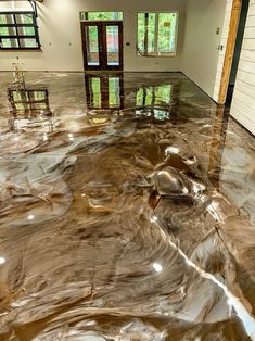 a large room with shiny floors and windows