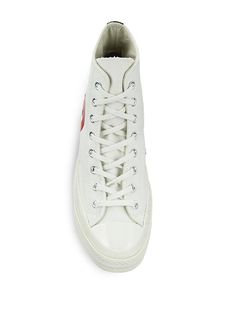 From the Comme des Garçons PLAY x Converse collaboration. Named for the basketball player-turned-salesman, these Chuck Taylor All Star sneakers are adorned with the Japanese label's heart-and-eyes, a motif created for Rei Kawakubo by Filip Pagowski in 2010. These unisex sneakers are designed in a high-top silhouette with a cotton-canvas upper..Canvas upper.Round toe.Lace-up vamp.Rubber sole.Imported.SIZE.Platform, 1'.Shaft, 5'.Leg opening, 9'.From the Comme des Garçons PLAY x Converse collaboration. Named for the basketball player-turned-salesman, these Chuck Taylor All Star sneakers are adorned with the Japanese label's heart-and-eyes, a motif created for Rei Kawakubo by Filip Pagowski in 2010. These unisex sneakers are designed in a high-top silhouette with a cotton-canvas upper.Canvas u White Custom Sneakers With Embroidered Logo For Sports, High-top Custom Sneakers With Logo For Streetwear, Custom High-top Sneakers For Streetwear With Logo, Custom White High-top Sneakers With Logo Detail, Sporty Custom High-top Sneakers With Embroidered Logo, Custom High-top Sneakers With Embroidered Logo, Custom High-top Sneakers With Embroidered Logo And White Sole, Custom High-top Sneakers With Embroidered Logo For Sports, Custom White Sneakers With Logo Detail For Sports