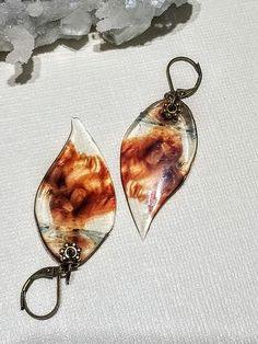 Images of a smoldering, bronze smoke in glass-like resin.  Dangling 1.5" from elegant bronze locking hooks. Wonderful for any occasion: weddings, work, special occasions, dress up, etc!  Leaf images are encased in double layers of jewelry grade resin for durability. All paid orders will be shipped within 2-3 business days unless otherwise noted. In an effort to go green, I do not print out receipts but will happily email you a copy upon request! Do you need faster shipping? Message me! Vintage Resin Jewelry For Parties, Vintage Resin Jewelry For Party, Elegant Adjustable Tortoiseshell Jewelry, Elegant Resin Earrings As Gift, Amber Copper Earrings As Gift, Elegant Nickel-free Resin Jewelry, Brown Victorian Jewelry Gift, Clear Resin Jewelry With Ear Wire, Handmade Vintage Resin Earrings