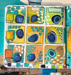 an art journal with blue and yellow designs