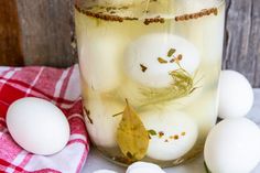 an image of boiled eggs and herbs in a jar