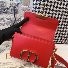 CHRSTN DR Mini 30 Montaigne Bag Gold toned hardware Red For Women 18cm/7in CD Rep 1:1 Measurements: 18 x 5 x 11.5 cm / 7 x 2 x 4.5 inches The 30 Montaigne line, inspired by the hallmark address, offers essential pieces that embody the House’s iconic codes. The handbag is crafted in blue-gray box and embellished with a flap with an antique gold-finish metal ‘CD’ clasp, inspired by the seal of a CHRSTN DR perfume bottle. The miniature style has an adjustable shoulder strap and ca Dior Perfume Bottle, Christian Dior Perfume, Dior Perfume, Luxury Products, Belt Accessories, Evening Clutch Bag, Sierra Leone, Perfume Bottle, Tote Backpack